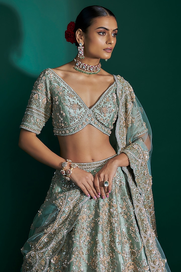 Dusty Firoza Raw Silk Sequins Hand & Machine Embroidered Bridal Lehenga Set by Kalighata at Pernia's Pop Up Shop