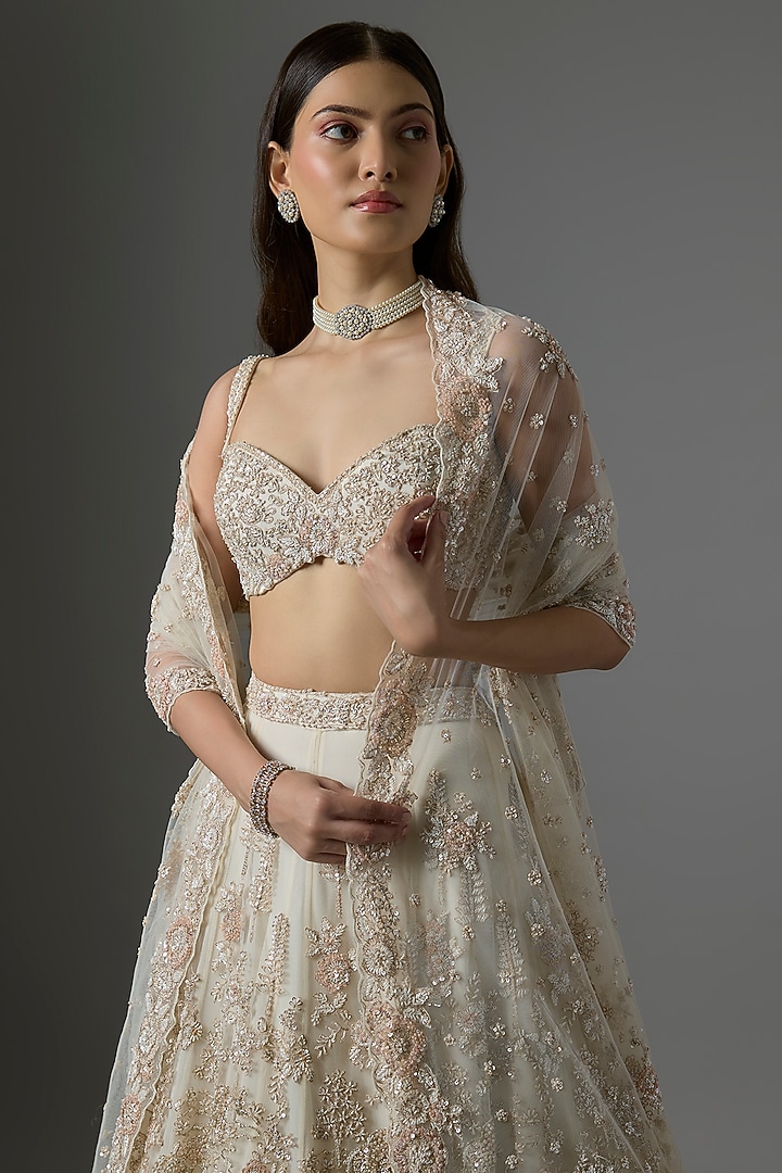 Ivory Net Embroidered Bridal Lehenga Set by Kalighata at Pernia's Pop Up Shop