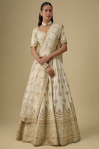 Ivory Raw Silk Hand & Machine Embroidered Lehenga Set by Kalighata