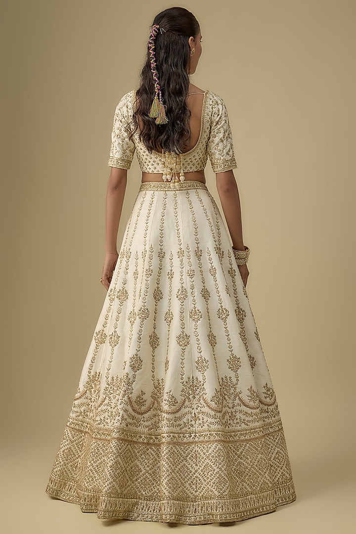 Ivory Raw Silk Hand & Machine Embroidered Bridal Lehenga Set by Kalighata at Pernia's Pop Up Shop
