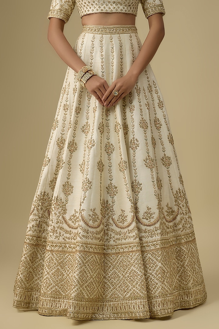 Ivory Raw Silk Hand & Machine Embroidered Bridal Lehenga Set by Kalighata at Pernia's Pop Up Shop