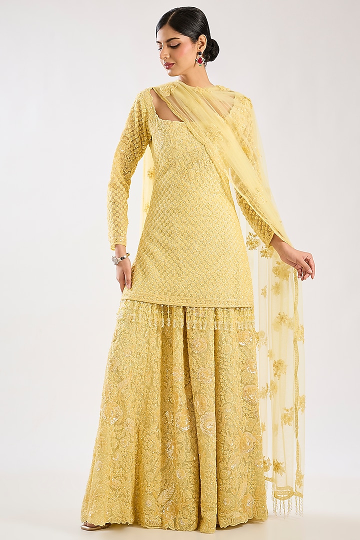 Yellow Net Hand & Machine Embroidered Bridal Sharara Set by Kalighata at Pernia's Pop Up Shop