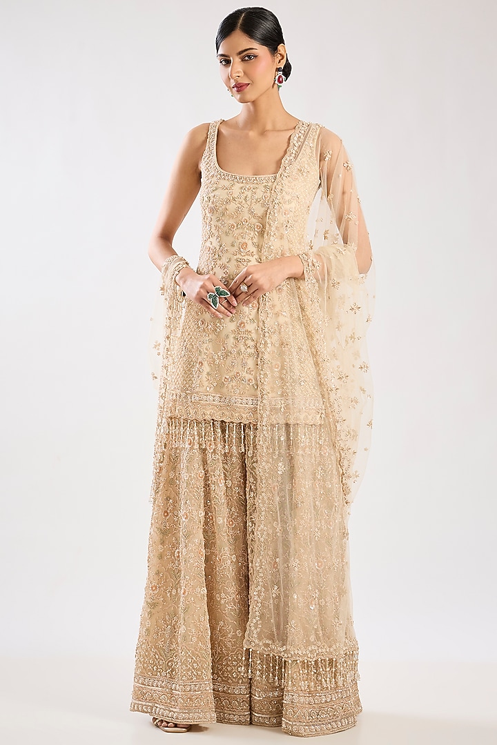Peach Net Hand & Machine Embroidered Bridal Sharara Set by Kalighata at Pernia's Pop Up Shop