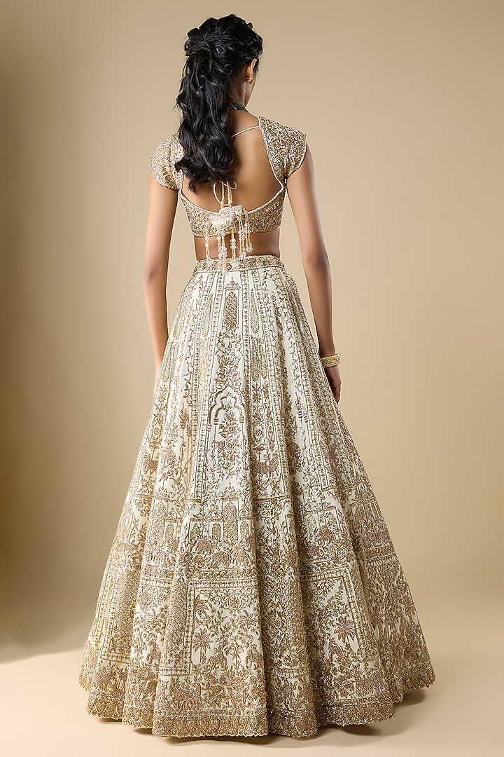 Ivory Raw Silk Zari Hand Embroidered Bridal Lehenga Set by Kalighata at Pernia's Pop Up Shop