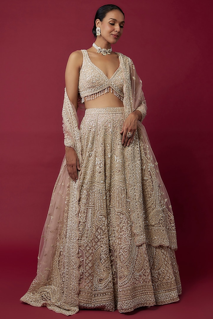 Ivory Net Sequins Embroidered Bridal Lehenga Set by Kalighata at Pernia's Pop Up Shop
