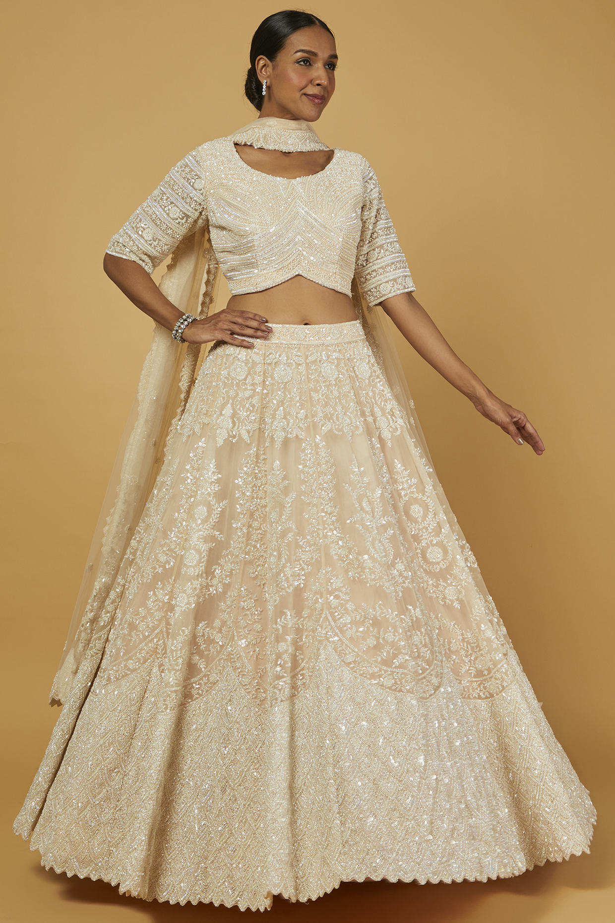 Peach Net Sequined Bridal Lehenga Set by Kalighata at Pernia's Pop Up Shop
