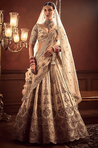 Ivory Raw Silk Hand & Machine Embroidered Lehenga Set by Kalighata