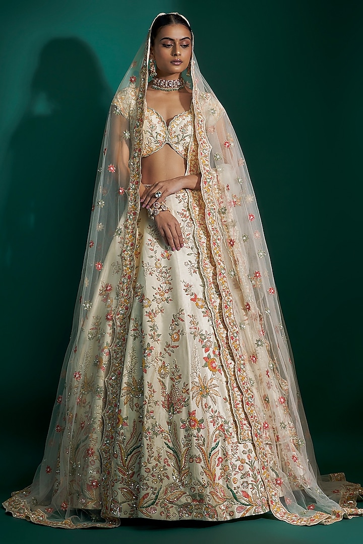 Ivory Raw Silk Sequins Hand & Machine Embroidered Bridal Lehenga Set by Kalighata at Pernia's Pop Up Shop