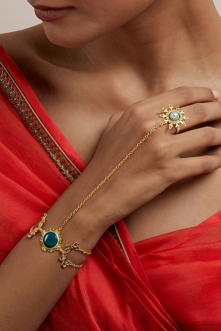 Gold Plated Pearl & Synthetic Emerald Stone Enamelled Haathphool by KIVAAKSHH at Pernia's Pop Up Shop