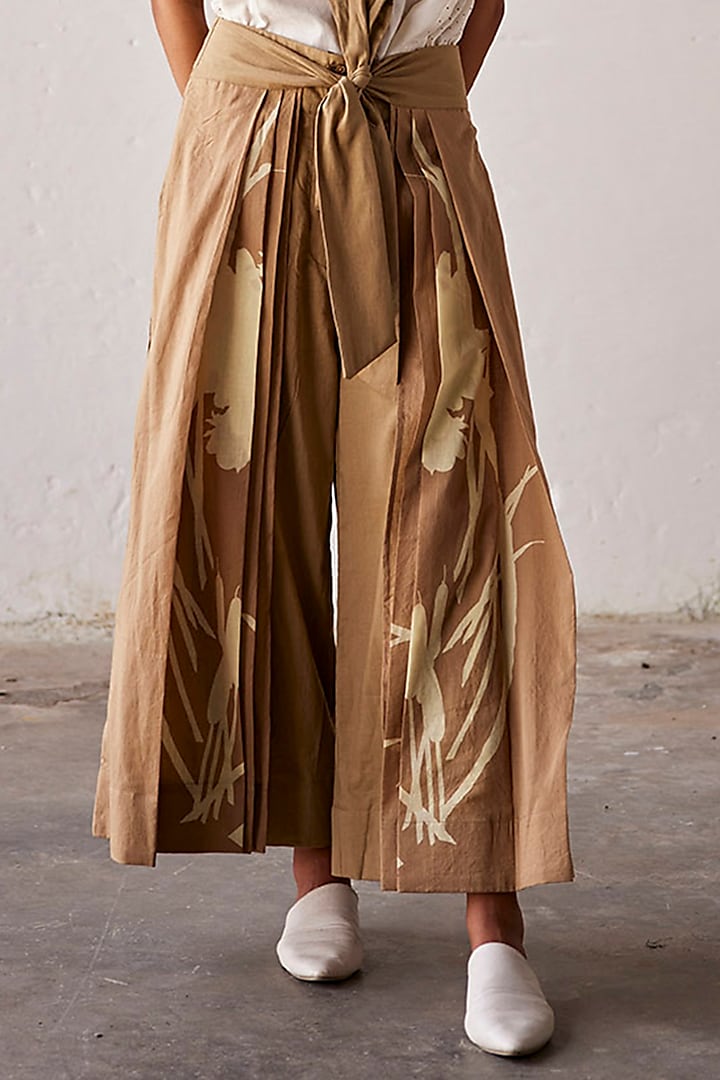 Camel Brown Mul Cotton Flared Pleated Trousers by Khara Kapas