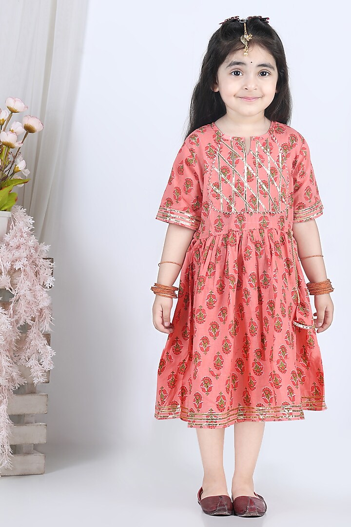 Peach Printed Dress For Girls by Kinder Kids at Pernia's Pop Up Shop