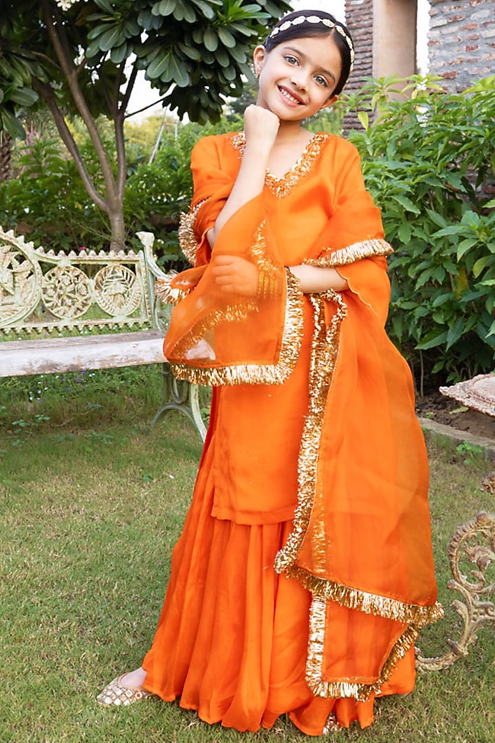 Bright Orange Chinnon Dabka & Sequin Embellished Sharara Set For Girls by Klistel at Pernia's Pop Up Shop