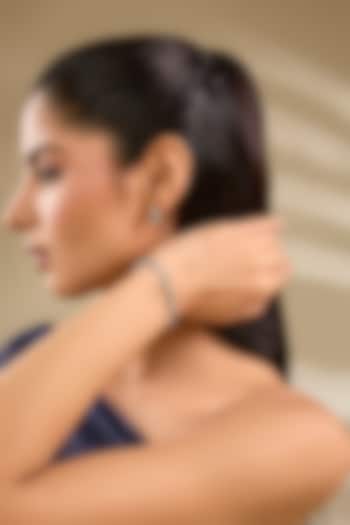 White Rhodium Finish Green Stone Stud Earrings With Bracelet by Just Shraddha at Pernia's Pop Up Shop