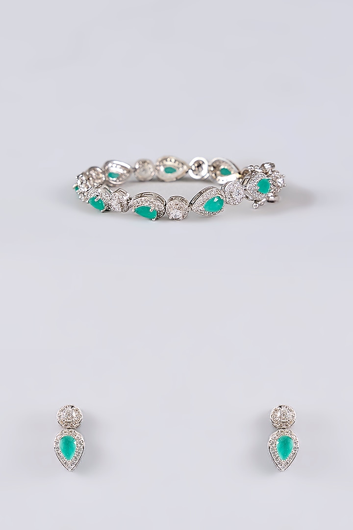 White Rhodium Finish Green Stone Stud Earrings With Bracelet by Just Shraddha at Pernia's Pop Up Shop