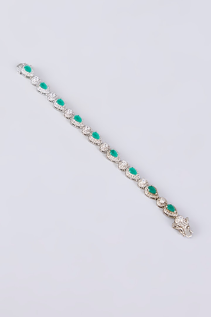 White Rhodium Finish Green Stone Stud Earrings With Bracelet by Just Shraddha at Pernia's Pop Up Shop