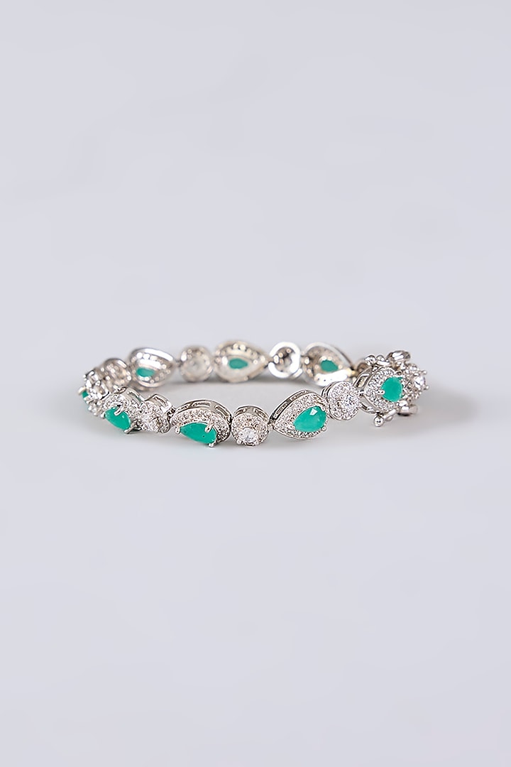 White Rhodium Finish Green Stone Stud Earrings With Bracelet by Just Shraddha at Pernia's Pop Up Shop