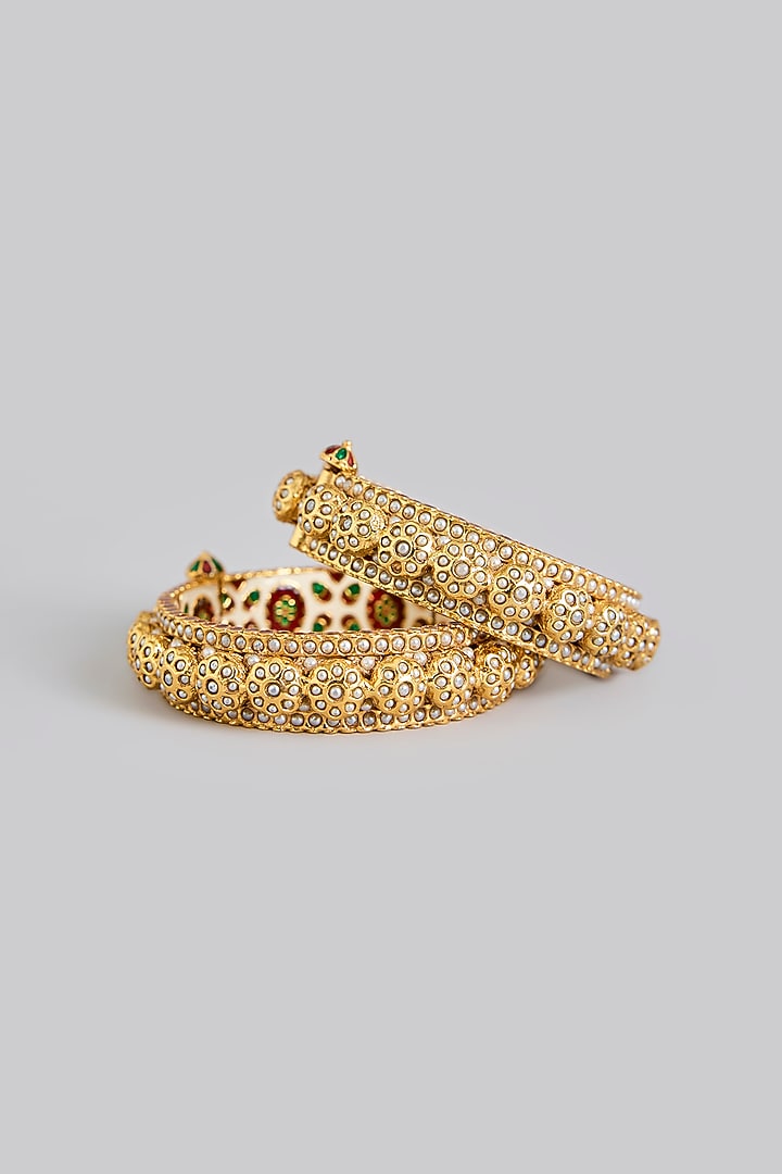 Gold Plated Kundan Polki & Pearl Bangles (Set Of 2) by Just Shraddha at Pernia's Pop Up Shop