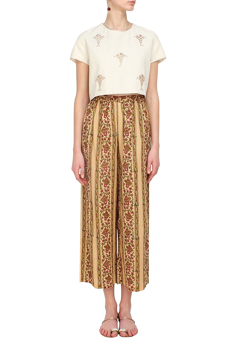 Biege, olive green and red floral printed flared pants available only at Pernia's Pop Up Shop.