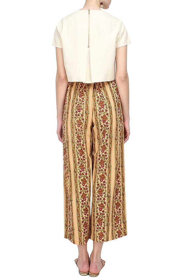 Biege, olive green and red floral printed flared pants available only at Pernia's Pop Up Shop.