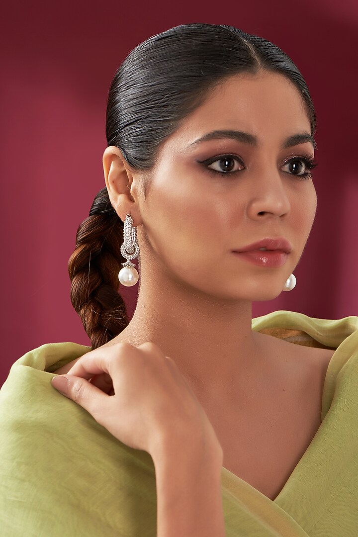 White Rhodium Finish Pearl Drop Hoop Earrings by Just Shraddha at Pernia's Pop Up Shop