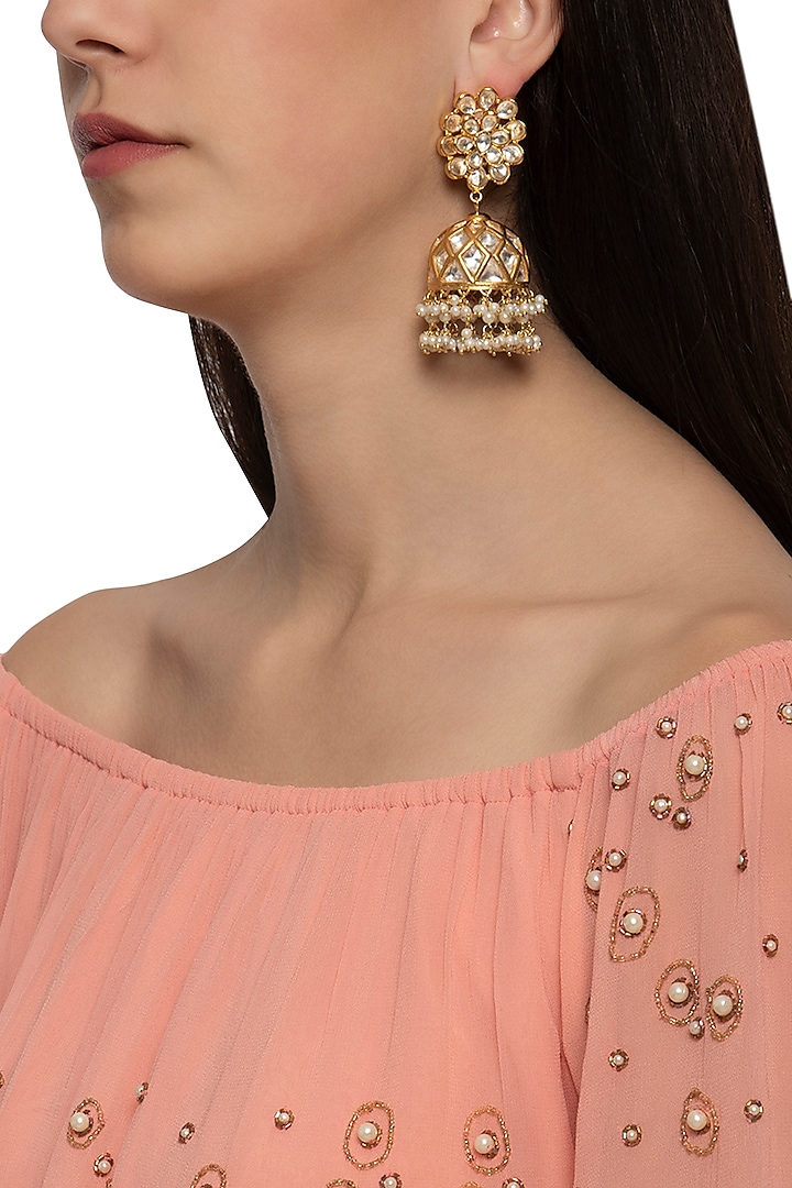 Gold plated floral jhumki earrings by Just Shraddha