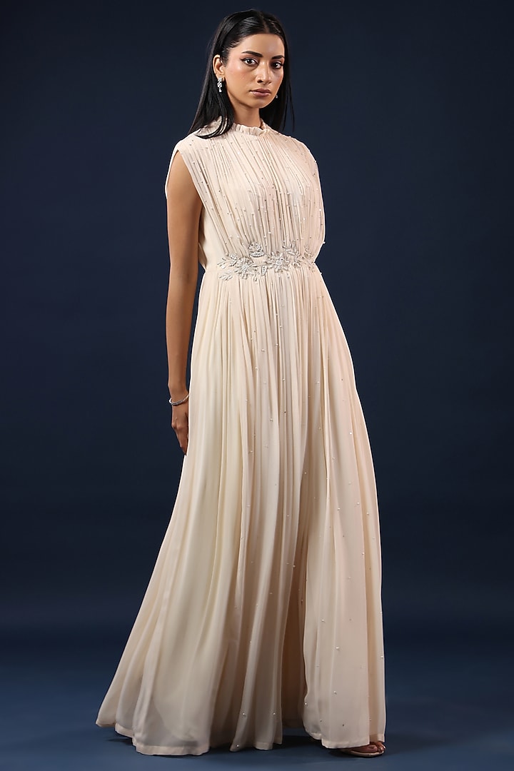 Off-White Georgette Sequin Embellished Pleated Party Wear Gown by K-ANSHIKA Jaipur at Pernia's Pop Up Shop