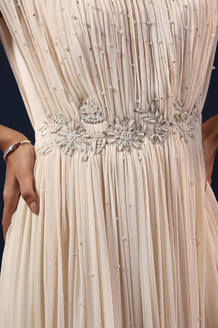 Off-White Georgette Sequin Embellished Pleated Party Wear Gown by K-ANSHIKA Jaipur at Pernia's Pop Up Shop