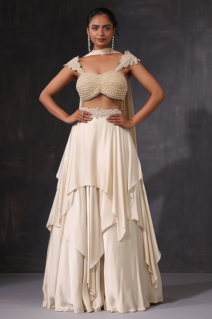 Off-White Cream Satin Ruffled Wedding Lehenga Set by K-ANSHIKA Jaipur at Pernia's Pop Up Shop