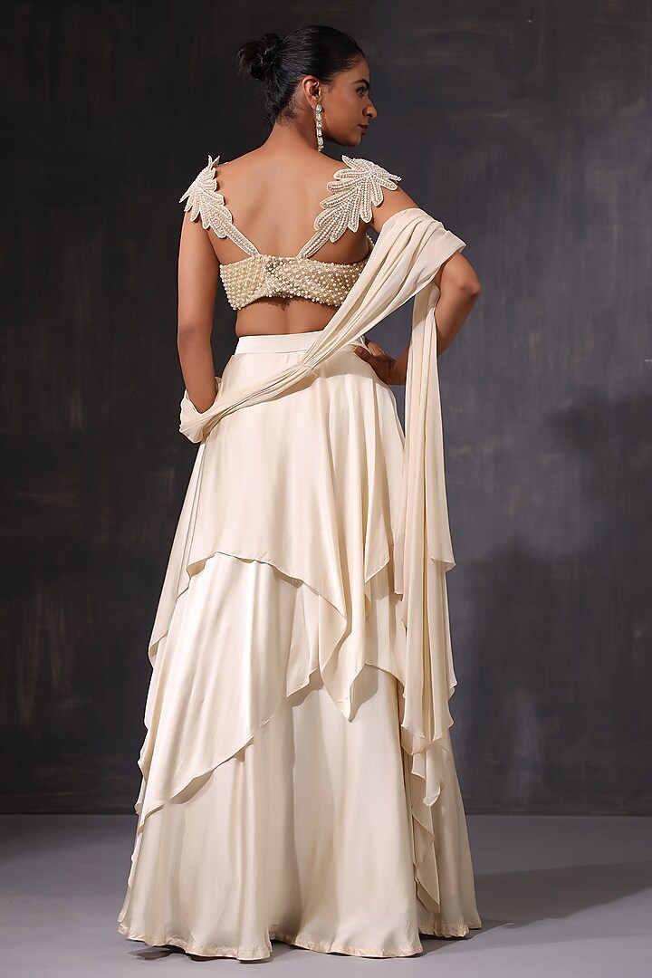 Off-White Cream Satin Ruffled Wedding Lehenga Set by K-ANSHIKA Jaipur at Pernia's Pop Up Shop