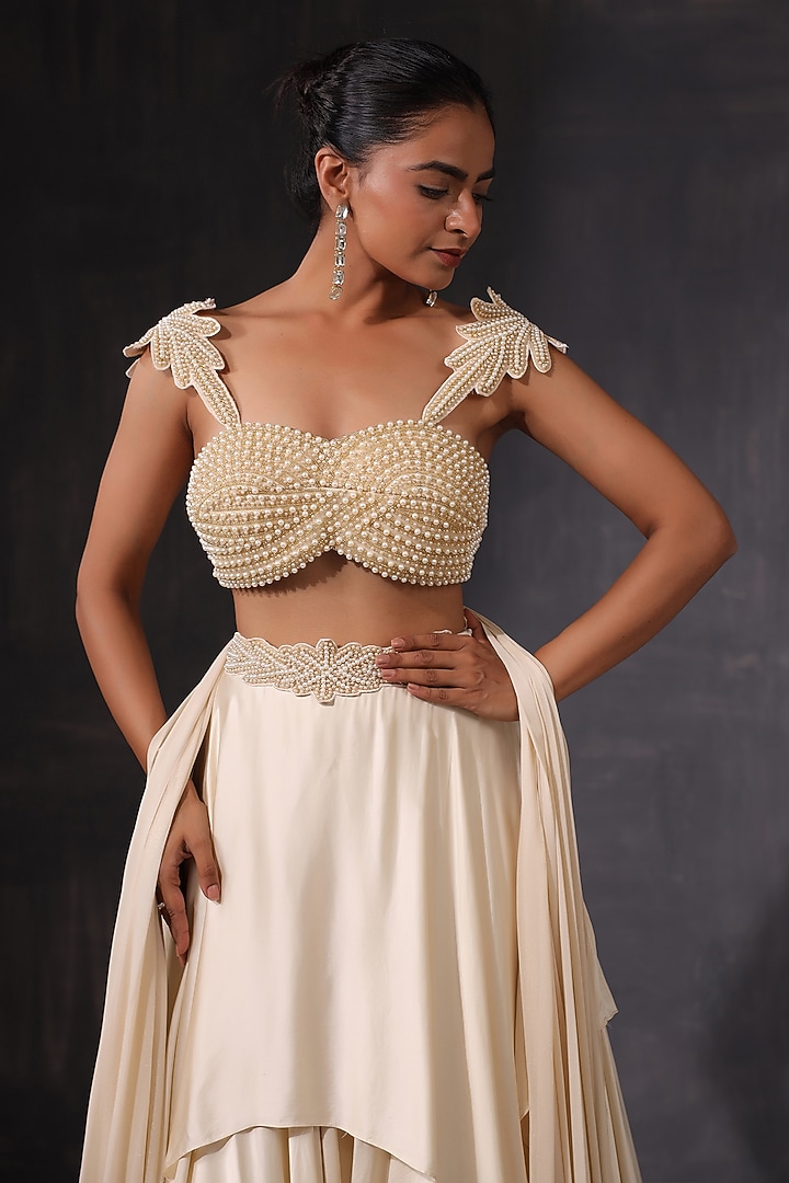 Off-White Cream Satin Ruffled Wedding Lehenga Set by K-ANSHIKA Jaipur at Pernia's Pop Up Shop