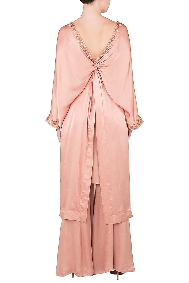 Dusty peach peplum fitted top and flared pants available only at Pernia's Pop Up Shop.