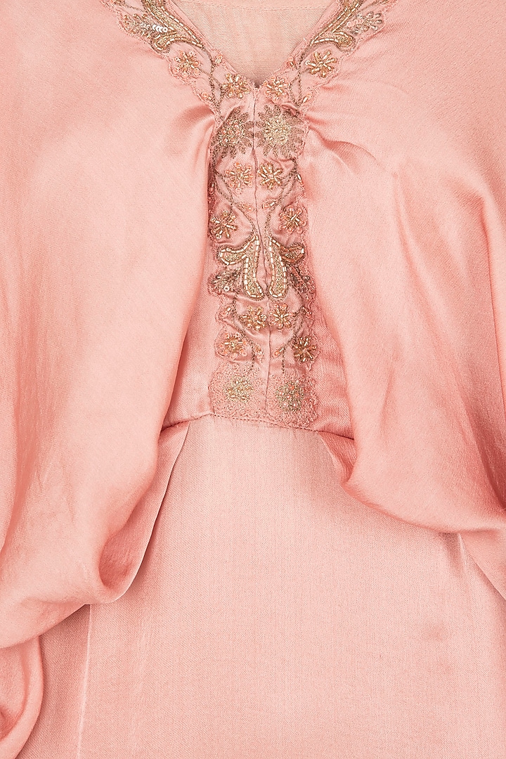 Dusty peach peplum fitted top and flared pants available only at Pernia's Pop Up Shop.