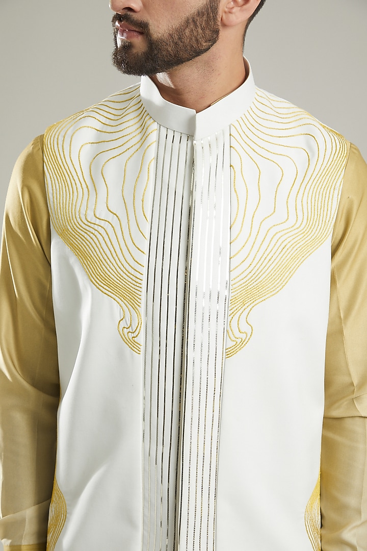Ivory Silk Thread & Aari Embroidered Bundi Jacket Set by KODEXRAUL at Pernia's Pop Up Shop