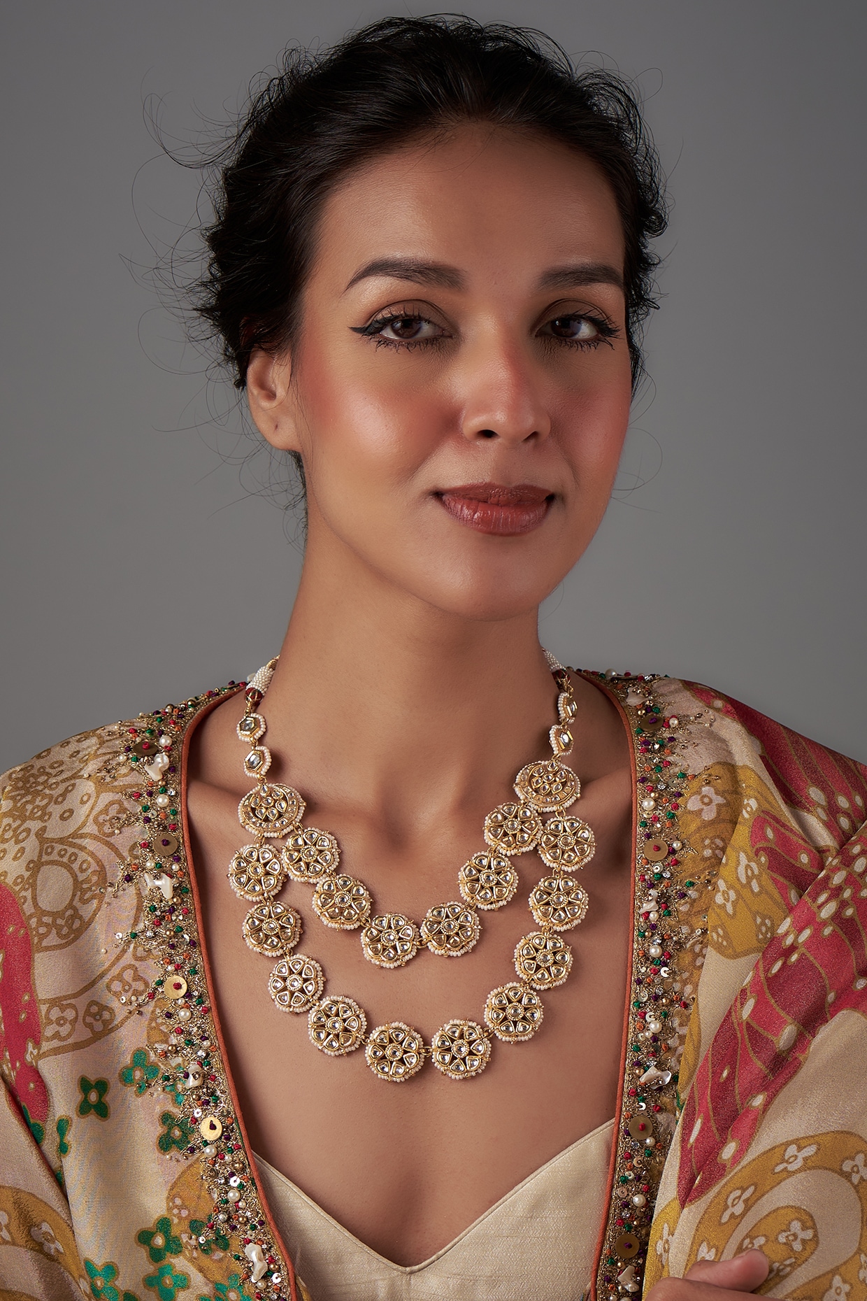 Designer gold brass polish with kundanpolki,shell pealrs and onyx carved stone