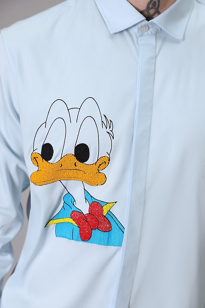 Powder Blue Cotton Satin Donald Duck Hand Embroidered Party Wear Shirt by Komal Kothari at Pernia's Pop Up Shop