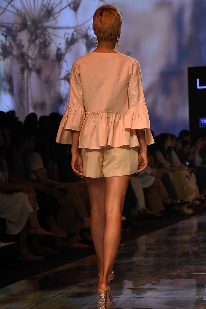 Peach Embroidered Peplum Jacket by House of Kotwara at Pernia's Pop Up Shop