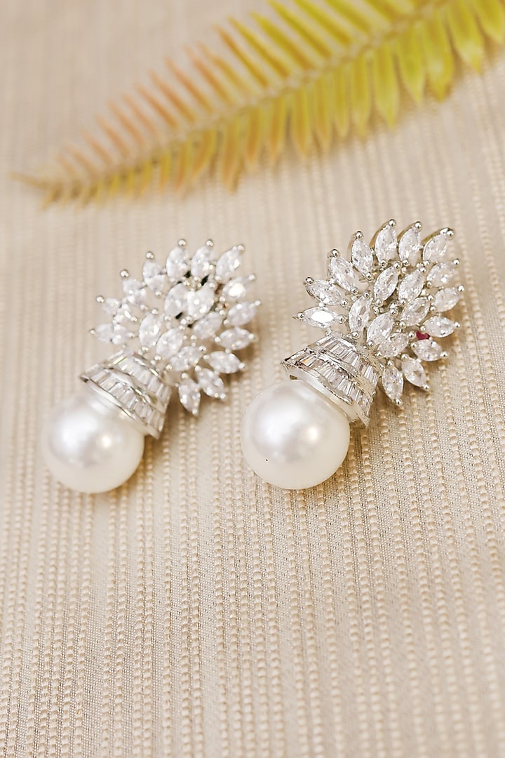 White Finish Zircon & Pearl Dangler Earrings by KRAFTSMITHS at Pernia's Pop Up Shop