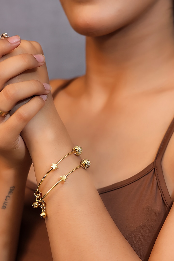 Gold Finish Ghungroo Handcrafted Bangles (Set Of 2) by KRAFTSMITHS at Pernia's Pop Up Shop