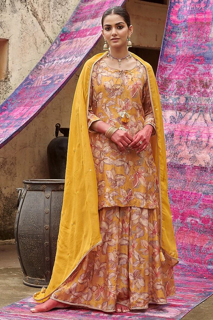 Mustard Muslin Floral Printed Gharara Set by Karaj Jaipur at Pernia's Pop Up Shop