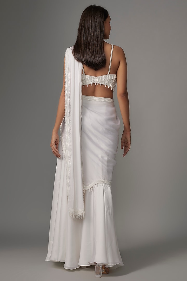 Ivory Satin Sequins Embroidered Tassel Fish-Cut Reception Saree Set by Kresha Lulla at Pernia's Pop Up Shop