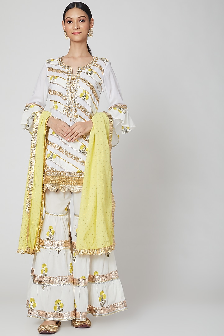 White Embroidered Gharara Set With Yellow Dupatta by kunwarani ritu at Pernia's Pop Up Shop