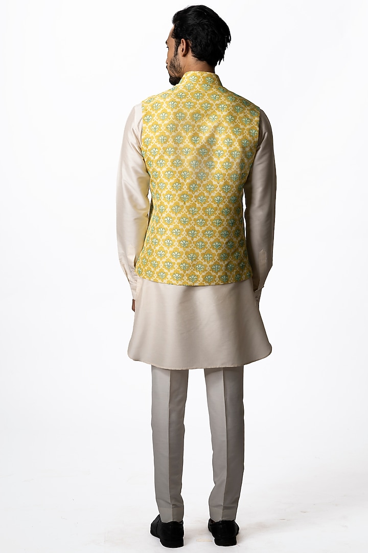 Yellow Tussar Embroidered & Block Printed Bundi Jacket by Krishna Mehta Men at Pernia's Pop Up Shop