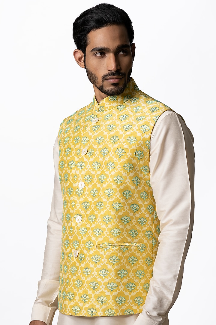 Yellow Tussar Embroidered & Block Printed Bundi Jacket by Krishna Mehta Men at Pernia's Pop Up Shop