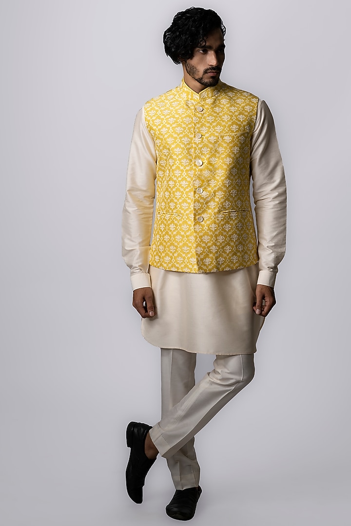 Yellow Tussar Embroidered & Block Printed Bundi Jacket by Krishna Mehta Men at Pernia's Pop Up Shop