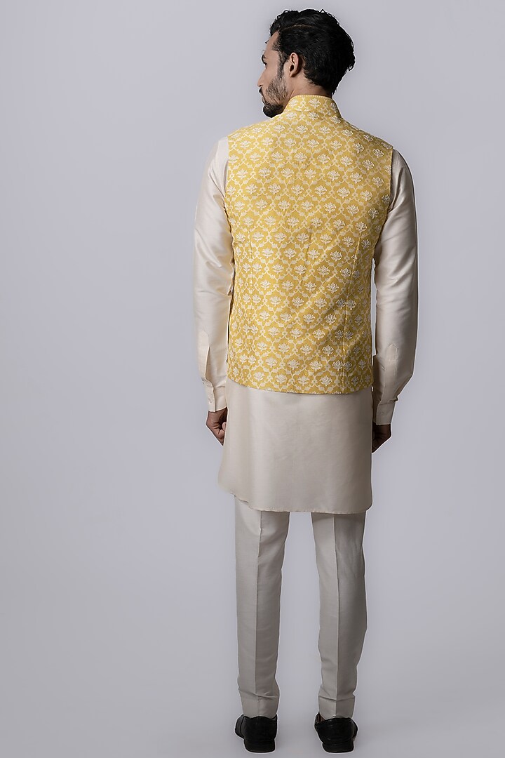 Yellow Tussar Embroidered & Block Printed Bundi Jacket by Krishna Mehta Men at Pernia's Pop Up Shop