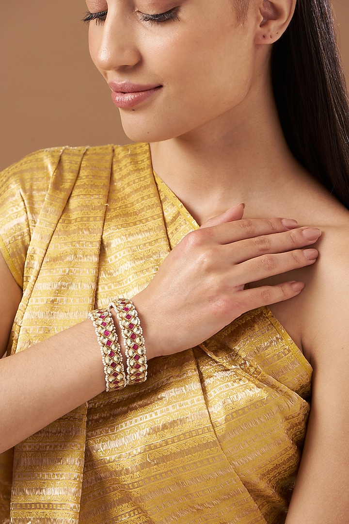 Gold Finish Kundan Polki & Moti Pirai Bangles (Set Of 2) by Kreart at Pernia's Pop Up Shop