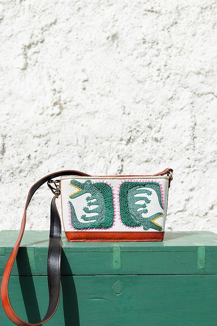 White Hand Embroidered Sling Bag by KrutiArts