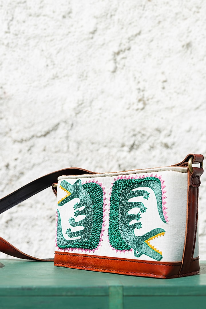 White Hand Embroidered Sling Bag by KrutiArts at Pernia's Pop Up Shop