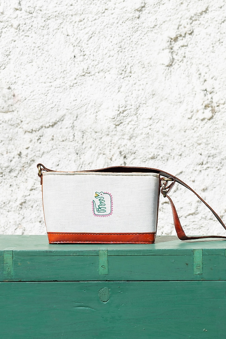 White Hand Embroidered Sling Bag by KrutiArts at Pernia's Pop Up Shop