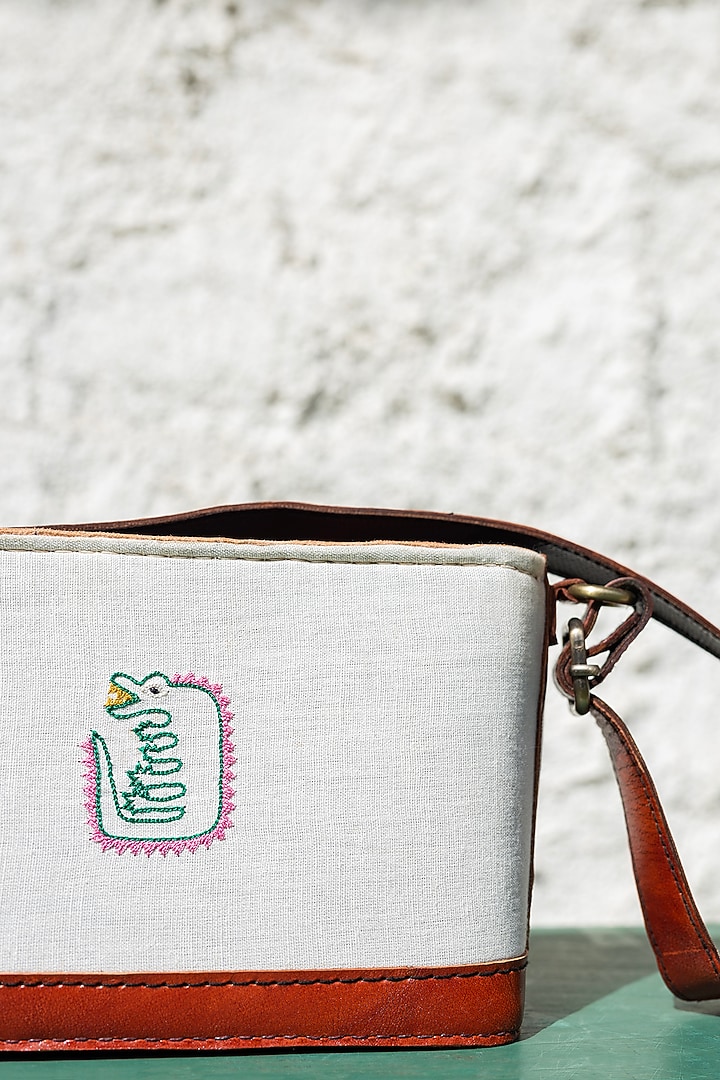 White Hand Embroidered Sling Bag by KrutiArts at Pernia's Pop Up Shop